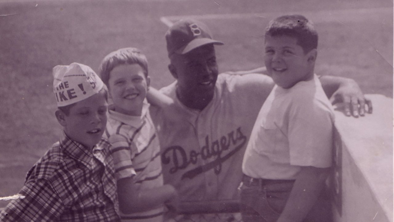 With Jackie Robinson looking over their shoulder, Ron Rabinovitz (right) and his friend Smith Treuer and his sister Judy, at Milwaukee's County Stadium.